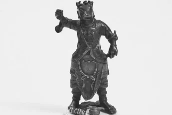 antique-chinese-bronze-deity-with-scroll-image-0